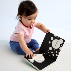 image of baby with book