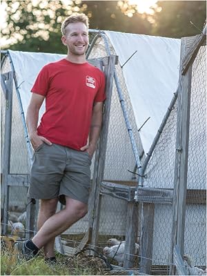 John Suscovich next to his chicken tractors