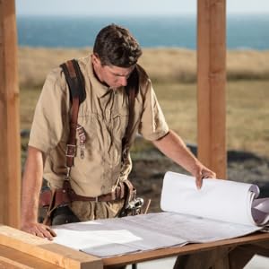 man looking at construction plans